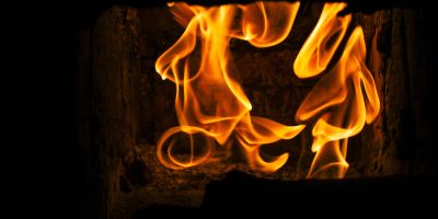 beautiful amazing view at burning fire flames at stone stove in room